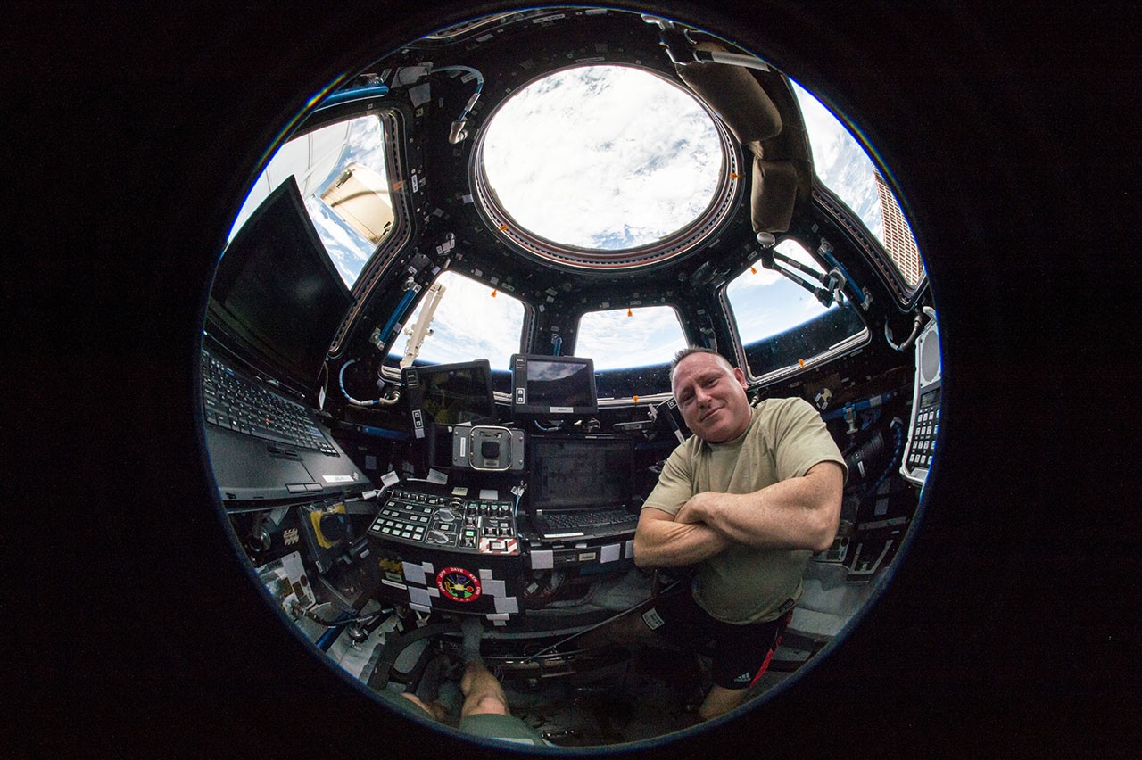 NASA astronaut Butch Wilmore, Expedition 42 Commander sits in the International Space Station’s CUPOLA in 2015.