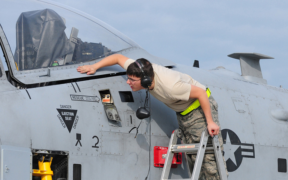 Ground crew member inspecting A-10 Thunderbolt II