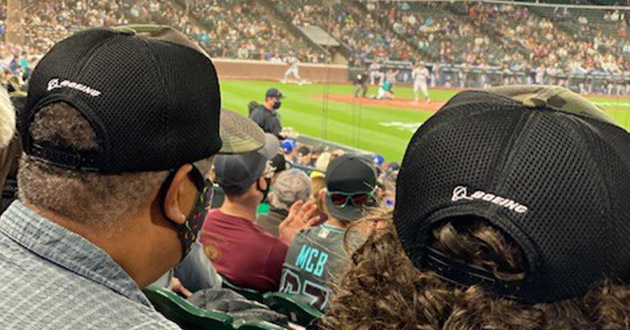 Fans wearing Mariners military caps