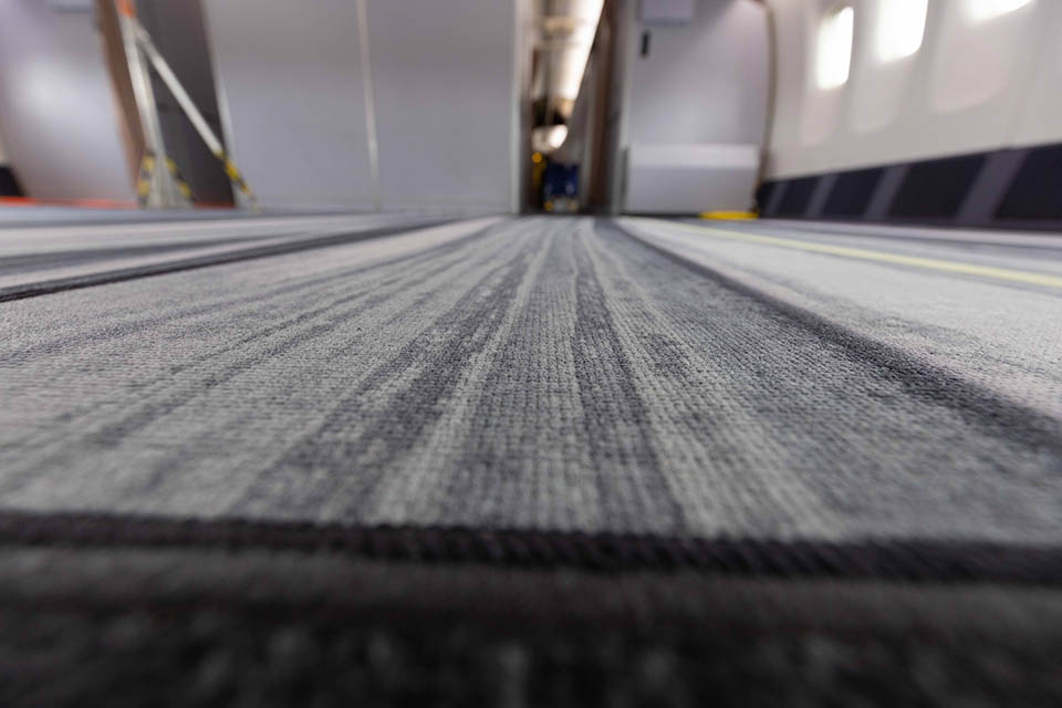 This deep-dyed carpet was installed for performance testing in the ecoDemonstrator cabin. It can save 120 pounds (54 kilograms) of weight on a 787-9. (Ryan Coe photo)