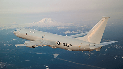 A U.S. Navy P-8A multi-mission maritime patrol aircraft flies near Mount Rainier in Washington state.